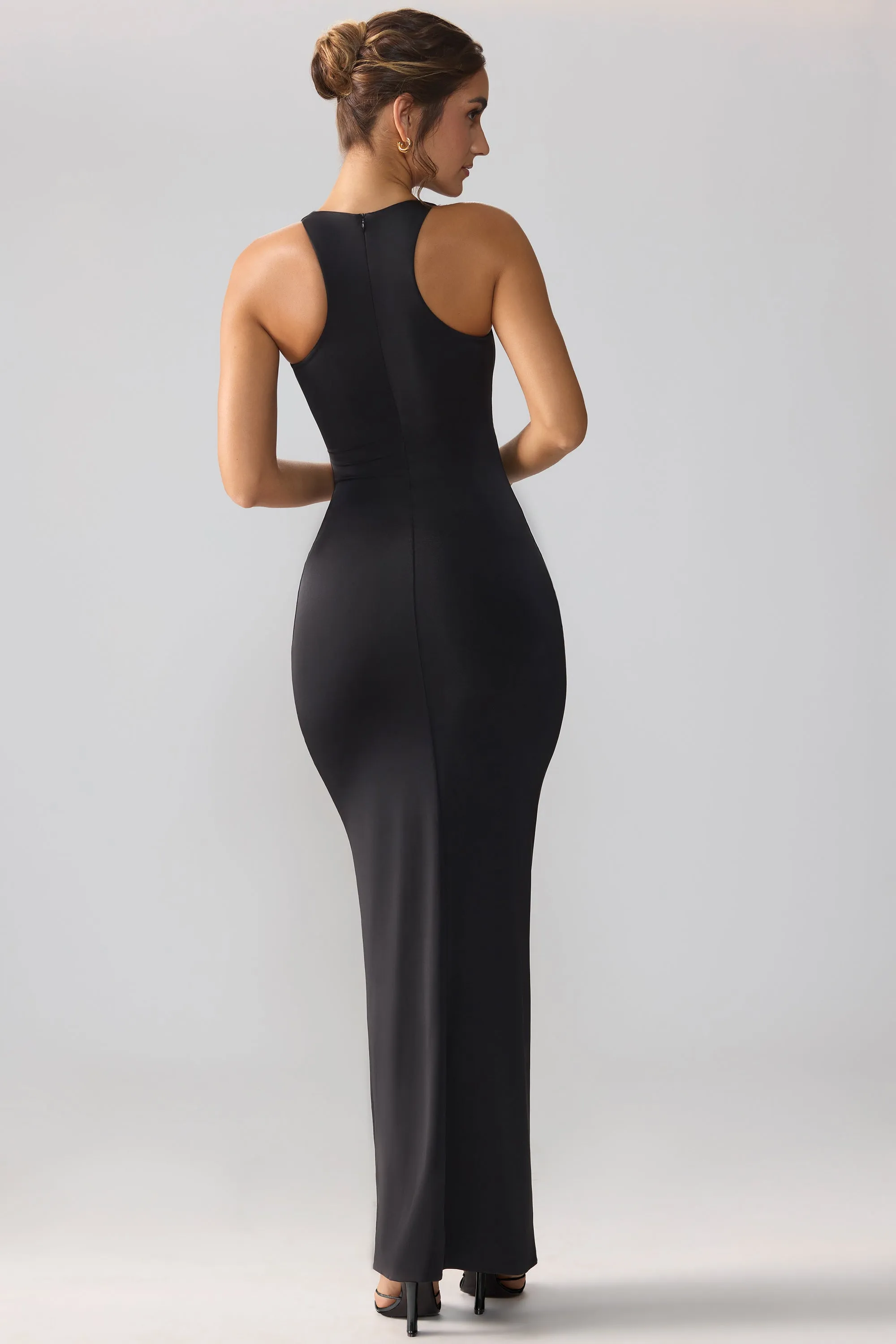 This dress provides a polished and sophisticated look while ensuring all-day comfort Mist Path Slinky Jersey Cut Out Ruffle Racerback Maxi Dress in Black