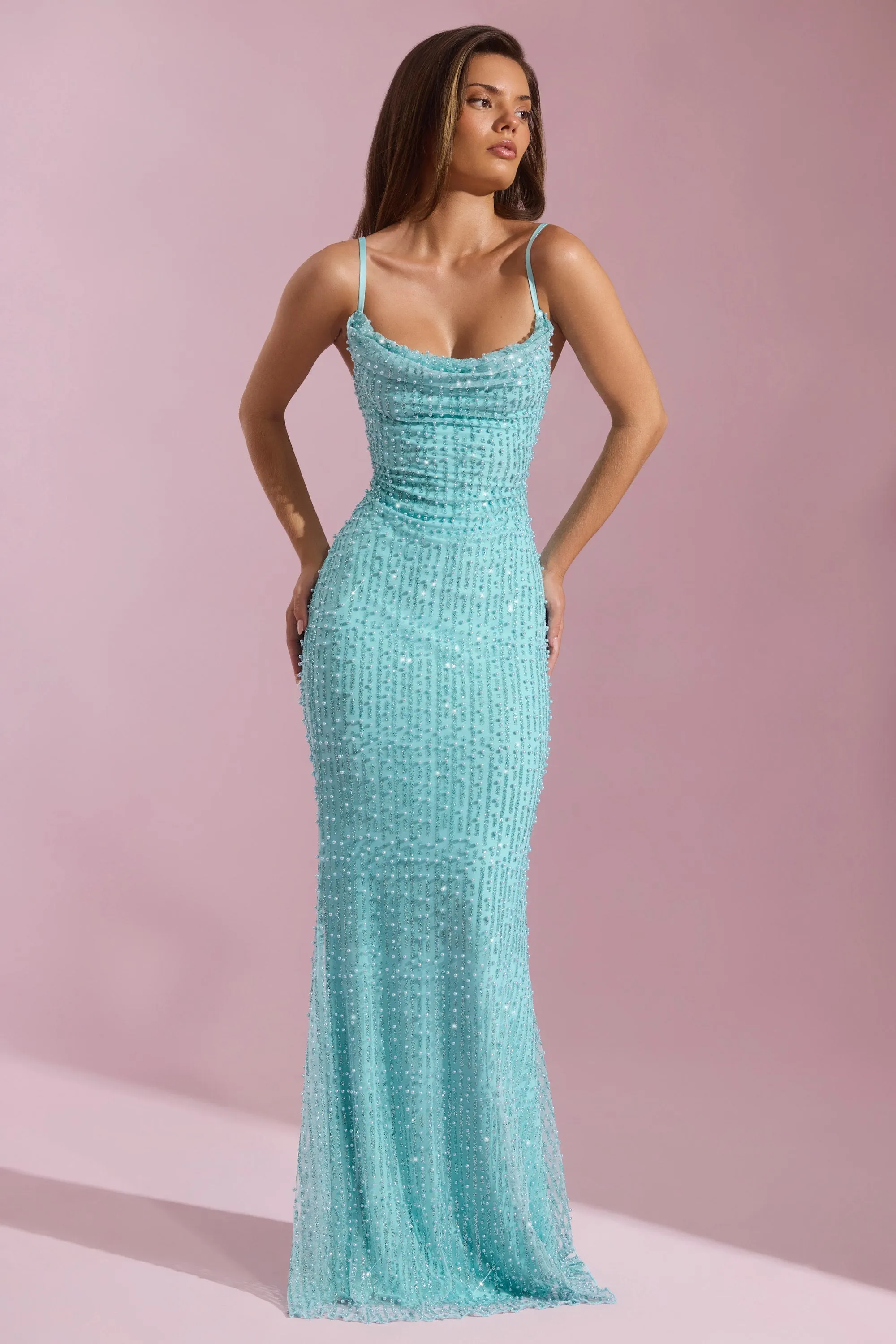 This maxi dress offers the perfect combination of comfort and style for everyday wear Drift Sand Embellished Cowl-Neck Backless Maxi Dress in Aqua Blue