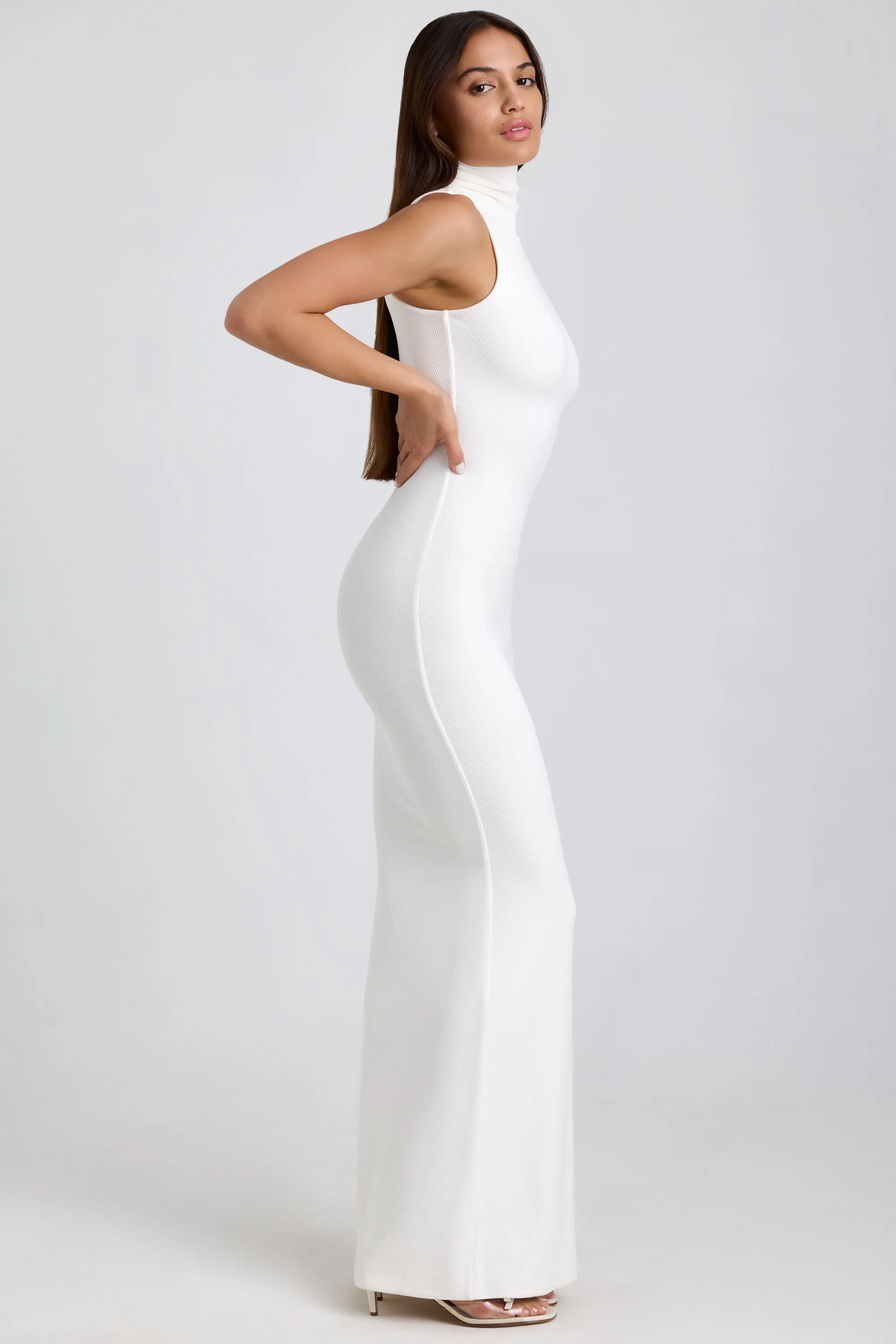 Ribbed Modal Turtleneck Maxi Dress in White Peony Bloom This maxi dress can easily transition from day to night with minimal effort