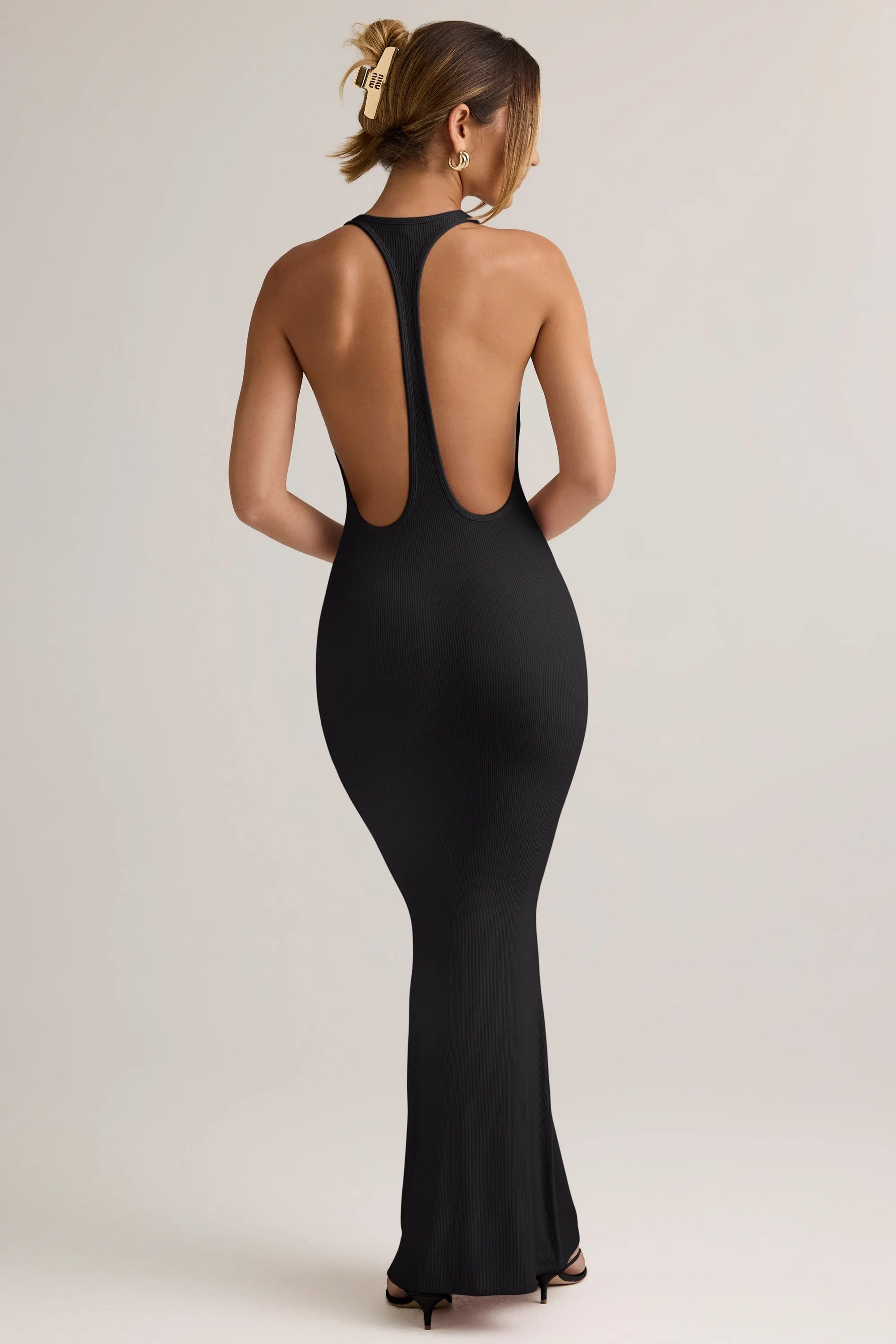 Its versatile length ensures it can be worn for a variety of occasions from casual to formal Fringe Glow Modal Racerback Maxi Dress in Black