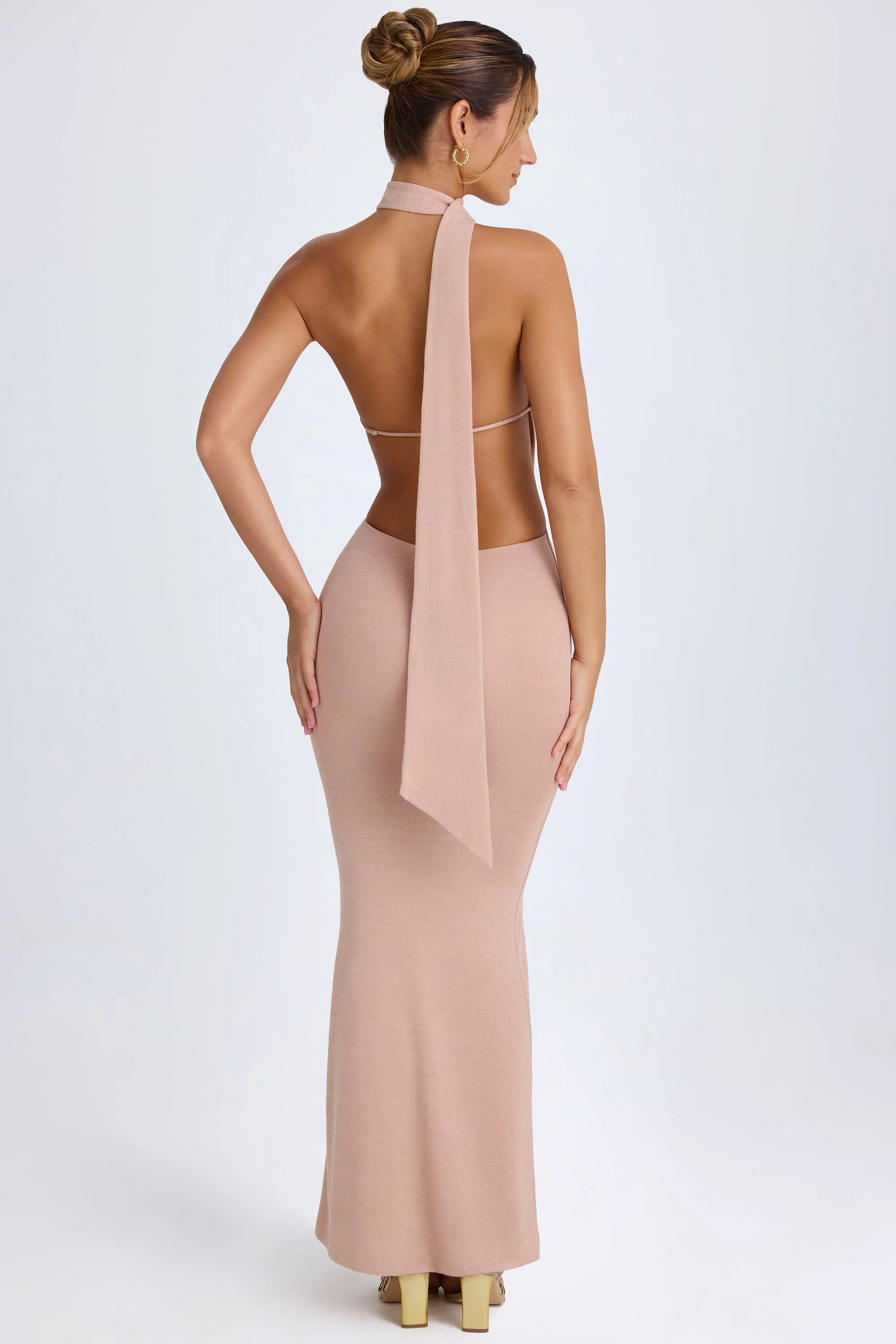 With its sleek and chic design this dress is perfect for both casual and formal settings Peony Bloom Scarf-Detail Cut-Out Halterneck Maxi Dress in Warm Peach