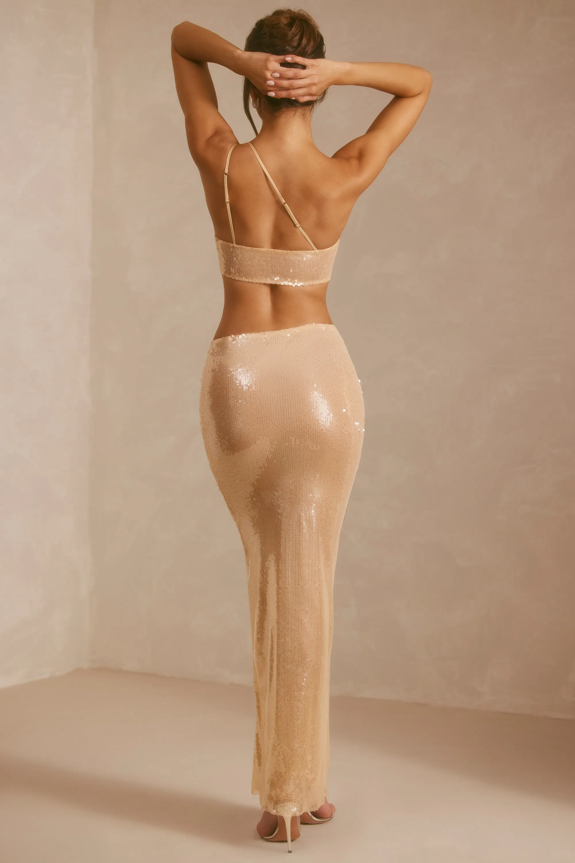 Sheer Sequin One Shoulder Cut Out Maxi Dress in Tan The long length of this dress provides ample coverage while remaining stylish This dress provides a polished and sophisticated look while ensuring all-day comfort