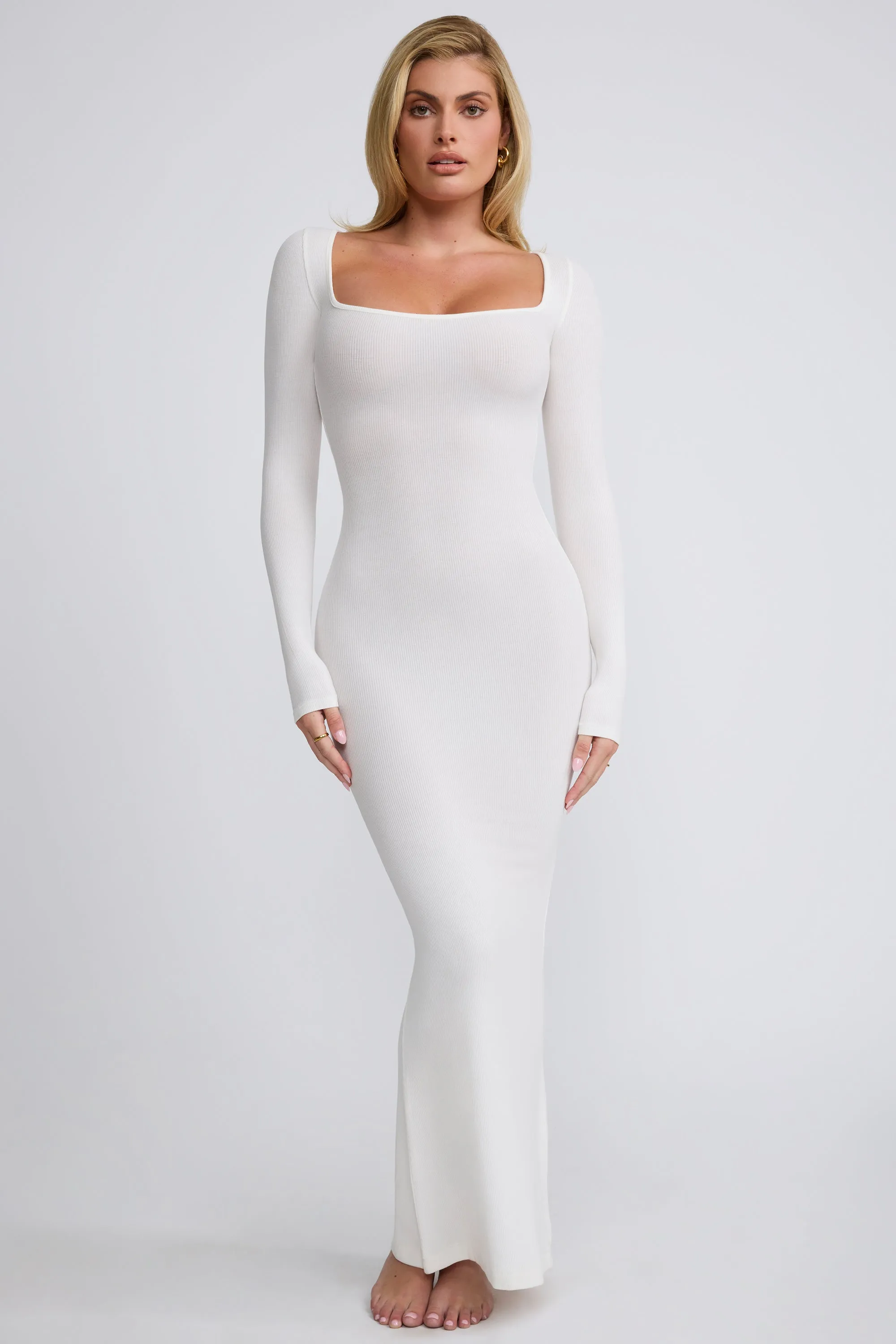 Ribbed Modal Long Sleeve Maxi Dress in White The simple design of this dress ensures that it will never go out of style Greek Touch