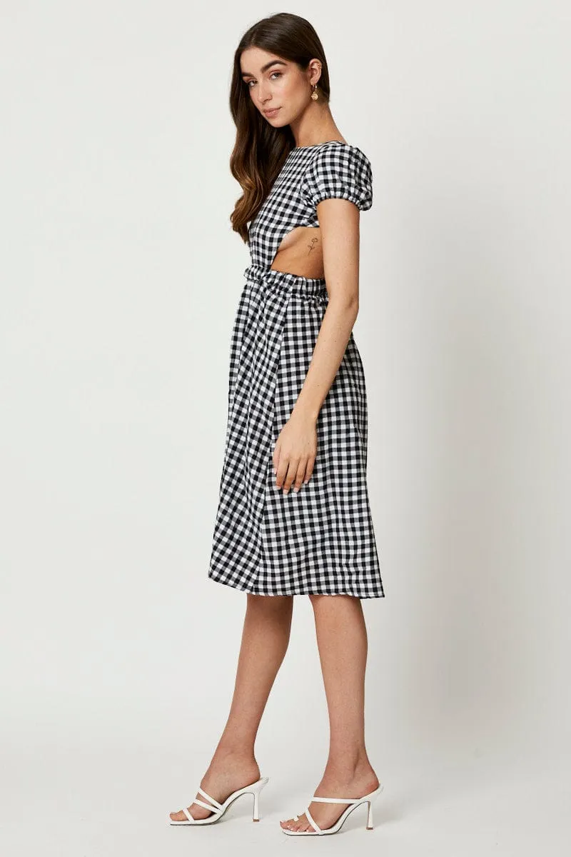 Black Check Cross Back Dress Harbor Stroll The flowing design of this dress provides plenty of movement while keeping you looking polished