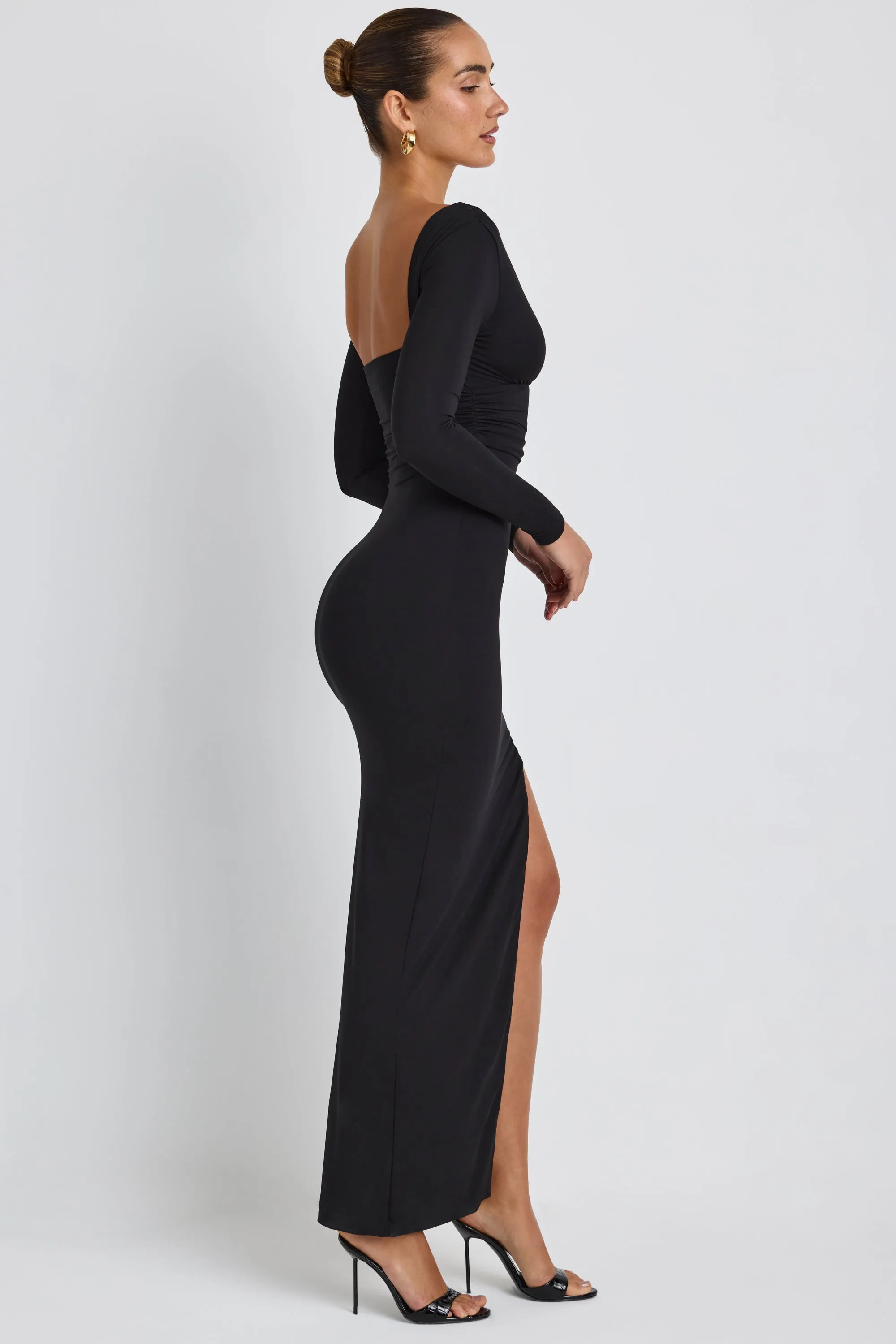 Modal Plunge Neck Long Sleeve Maxi Dress in Black The flowing design of this dress provides plenty of movement while keeping you looking polished