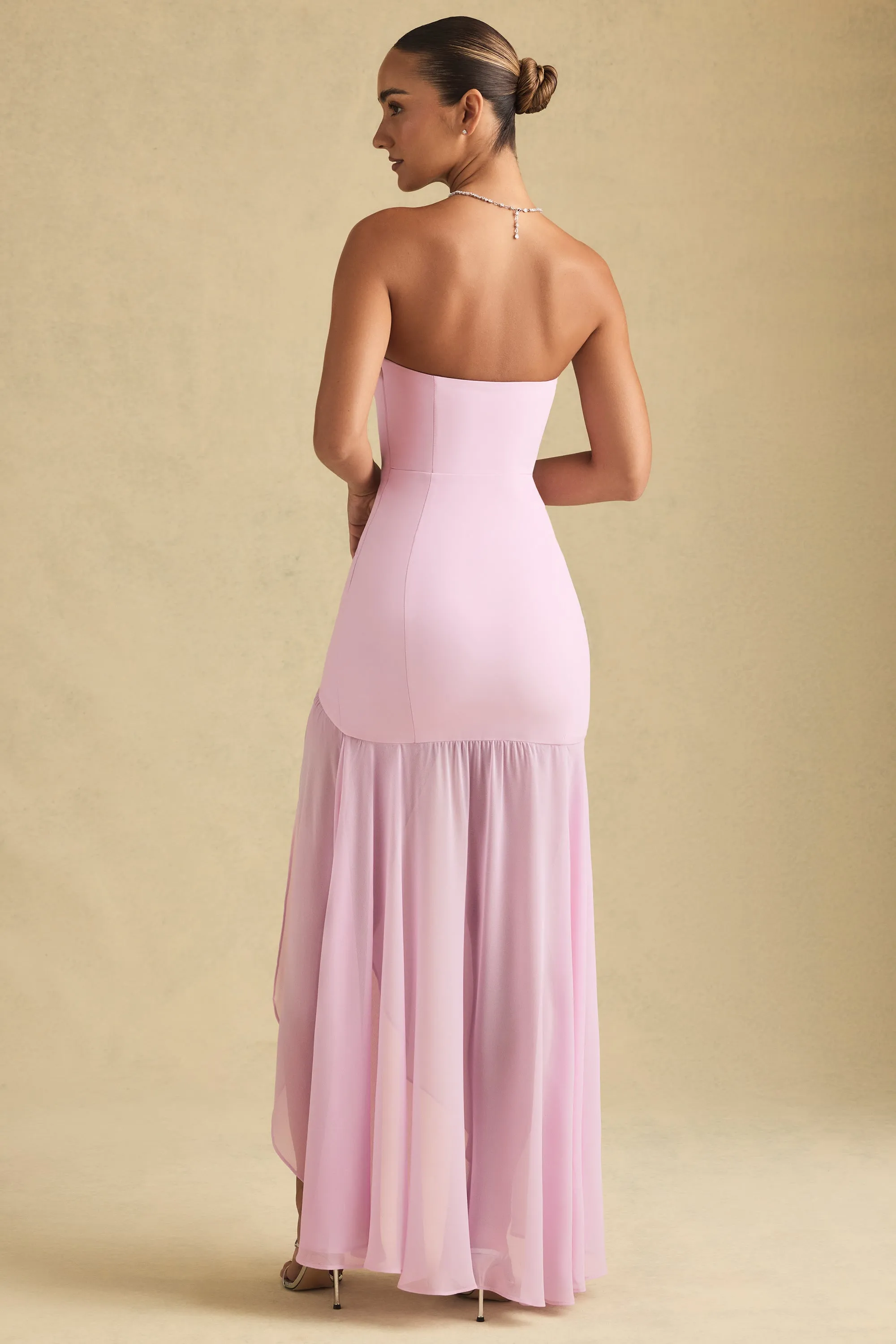 With its simple silhouette this maxi dress offers a flattering look for all body types Quiet Shore Asymmetric Strapless Fishtail Maxi Dress in Soft Pink