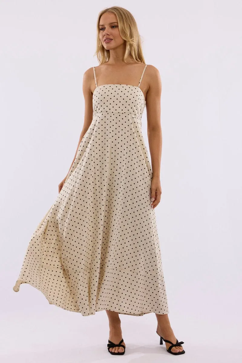 Beige Polka Dot Maxi Dress Strappy This maxi dress combines a relaxed fit with an elegant look for a versatile wardrobe piece
