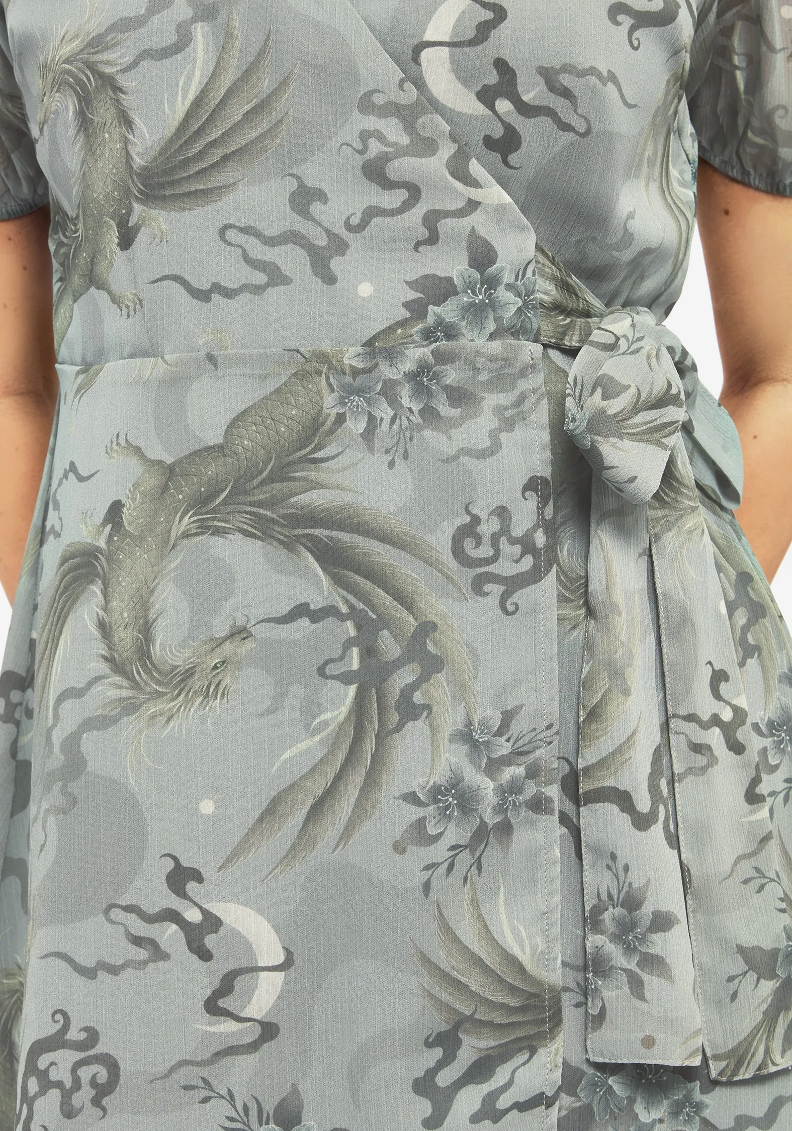 Casual yet chic piece Sapphira Dragon Print Chiffon Mini Wrap Dress