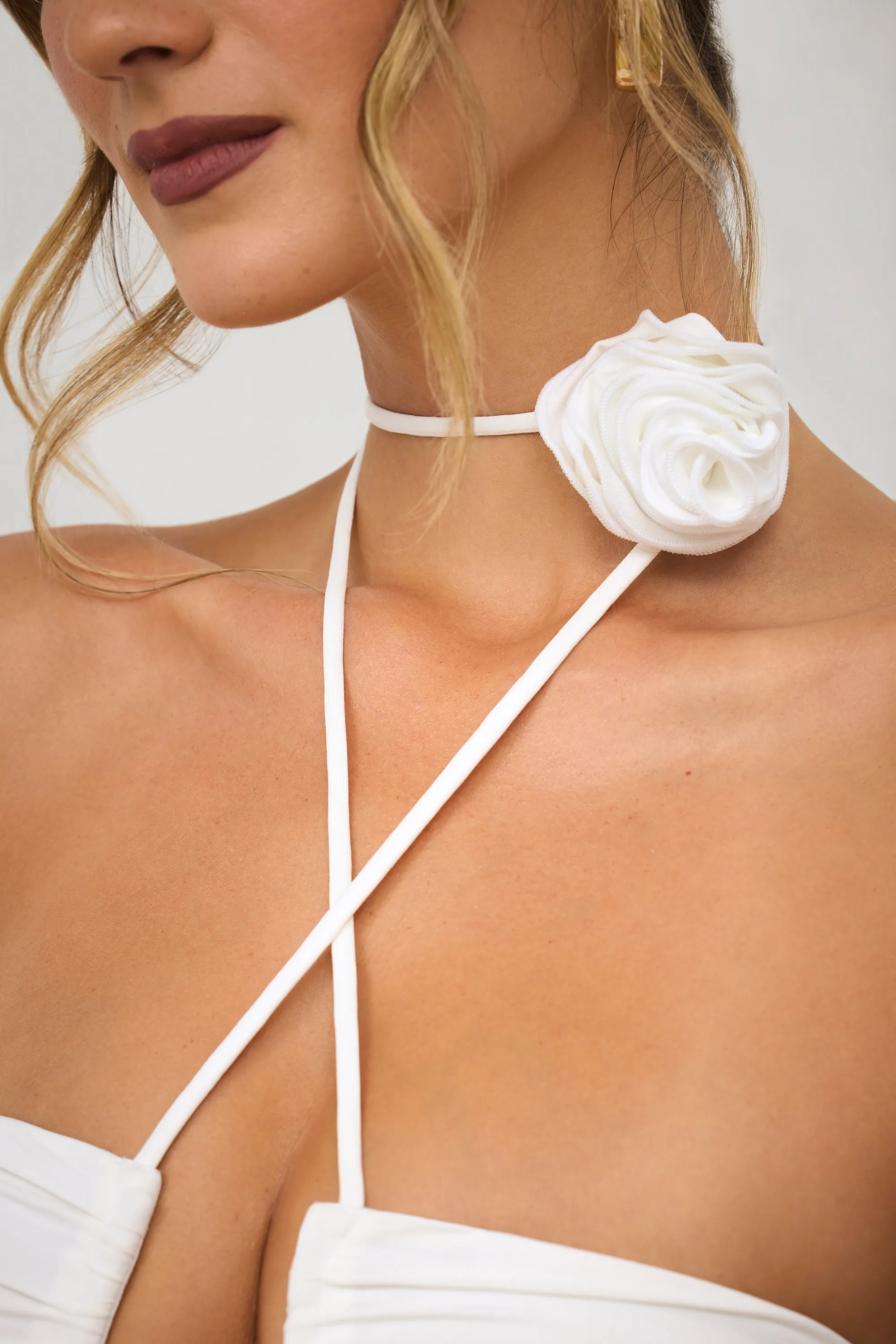 Slinky Jersey Rose Detail Halter Neck Maxi Dress in White With its timeless design this dress is perfect for any season and any setting