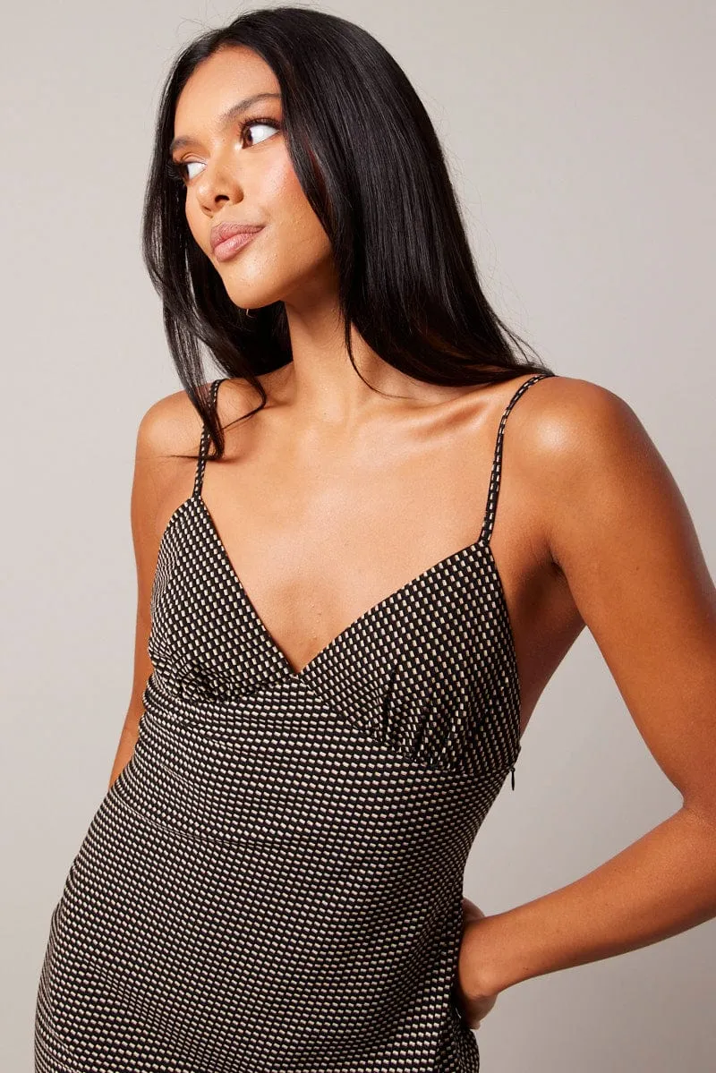 Black Geo Maxi Dress Strappy Perfect for warmer months this dress provides a light and breezy fit without sacrificing style
