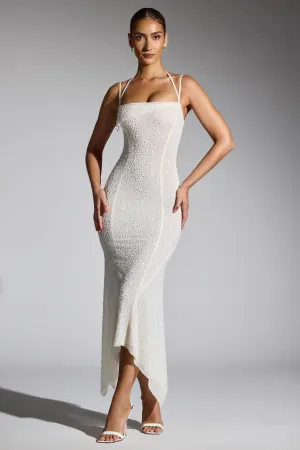 Embellished Handkerchief Hem Maxi Dress in White With its comfortable fit this dress is perfect for all-day wear while maintaining an elegant appearance
